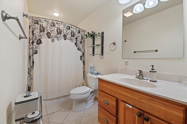 bathroom featuring toilet, lofted ceiling, vanity, and tile patterned floors