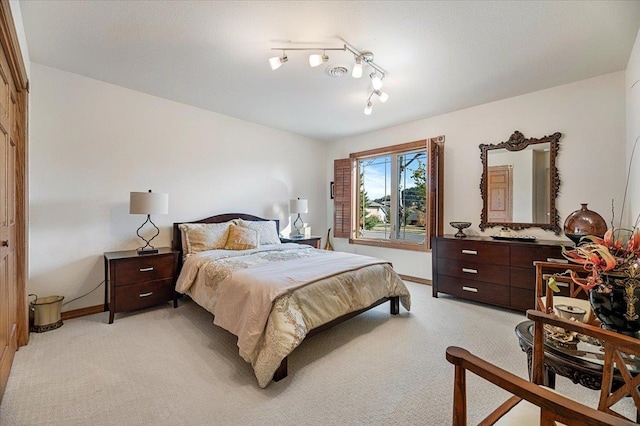 bedroom featuring light colored carpet