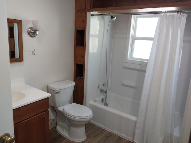 full bathroom with vanity, toilet, hardwood / wood-style flooring, and shower / bath combination with curtain