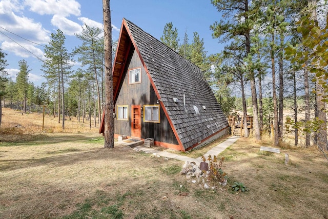 exterior space with an outbuilding and a yard