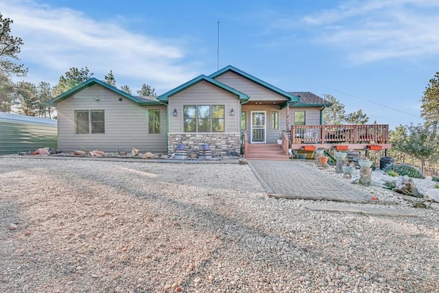 view of front of home featuring a wooden deck