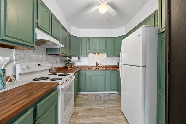 kitchen with white appliances, sink, butcher block counters, light hardwood / wood-style floors, and ceiling fan