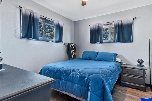 bedroom featuring dark hardwood / wood-style floors and ceiling fan