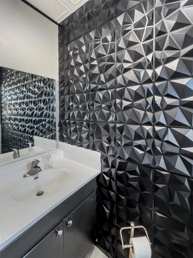 bathroom with tile walls and vanity