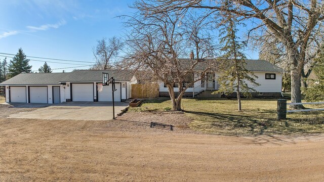 view of front of house with a front lawn and a garage