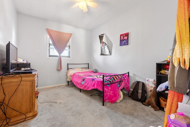 bedroom with ceiling fan and carpet