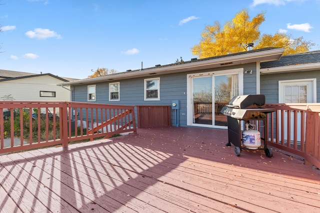 wooden terrace with area for grilling