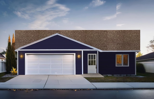 ranch-style house featuring a garage