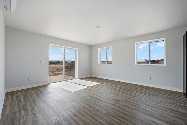10899 Eagle Ct, Belle Fourche, SD 57717 - empty room with baseboards and dark wood finished floors