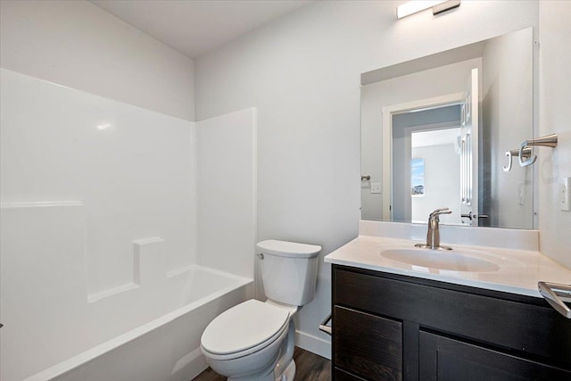 10899 Eagle Ct, Belle Fourche, SD 57717 - full bathroom with vanity, toilet, wood finished floors, and washtub / shower combination