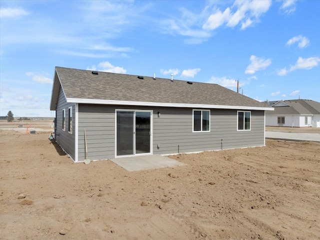 10899 Eagle Ct, Belle Fourche, SD 57717 - rear view of property featuring a shingled roof