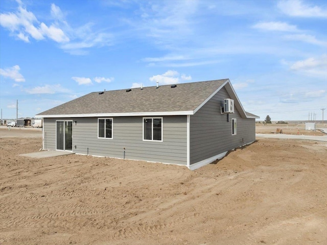 10899 Eagle Ct, Belle Fourche, SD 57717 - back of house featuring roof with shingles