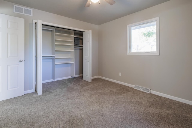 unfurnished bedroom with a closet, ceiling fan, and carpet