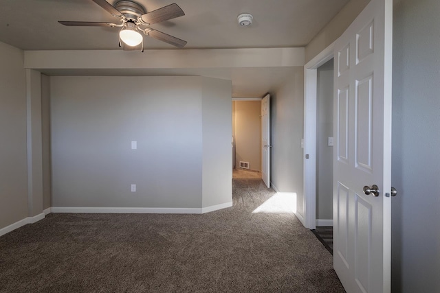 carpeted empty room featuring ceiling fan