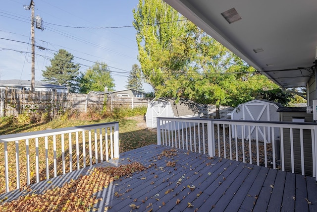 wooden terrace with a storage unit