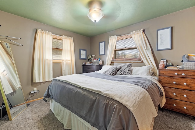 bedroom with ceiling fan and carpet floors