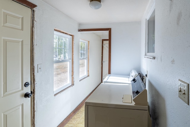 clothes washing area with independent washer and dryer