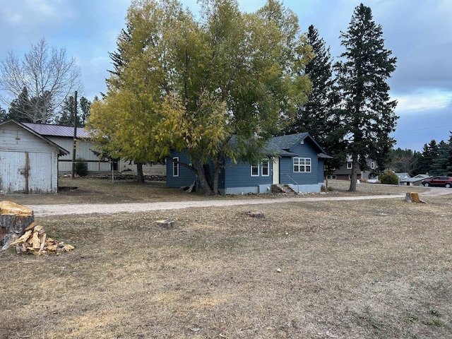 view of front facade featuring an outbuilding