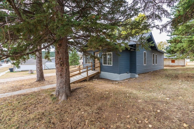 view of side of property with a deck