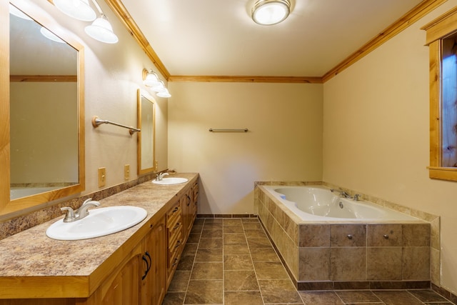 bathroom featuring vanity, crown molding, and tiled tub