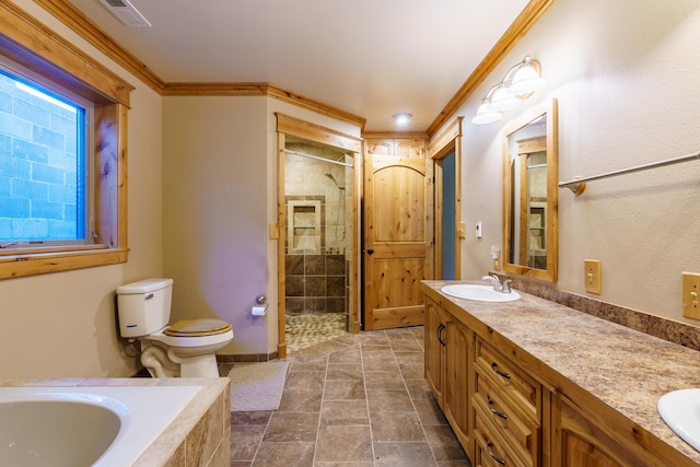 full bathroom featuring plus walk in shower, toilet, vanity, crown molding, and tile patterned flooring