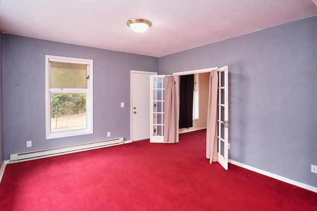 empty room with a baseboard radiator, french doors, and carpet flooring