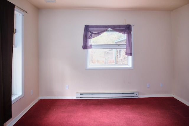 unfurnished room featuring a baseboard heating unit and carpet flooring