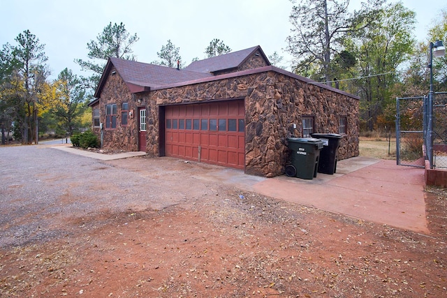 view of side of property with a garage