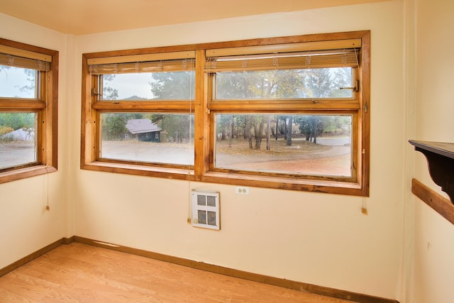 empty room featuring light hardwood / wood-style flooring and heating unit