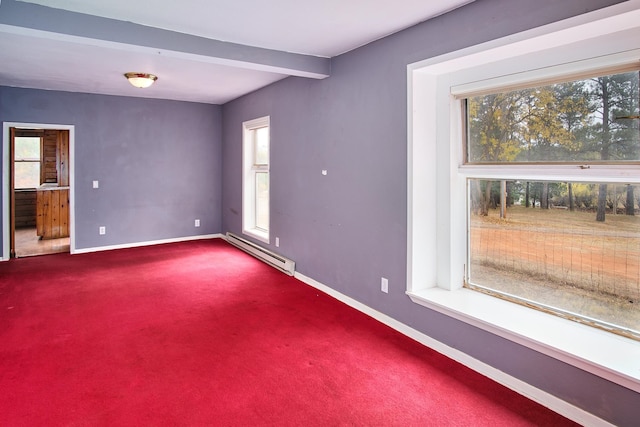 carpeted empty room with beamed ceiling and a baseboard heating unit