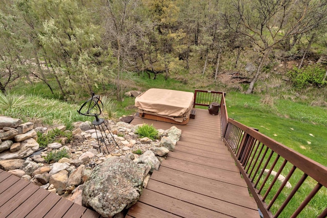 wooden deck featuring a yard