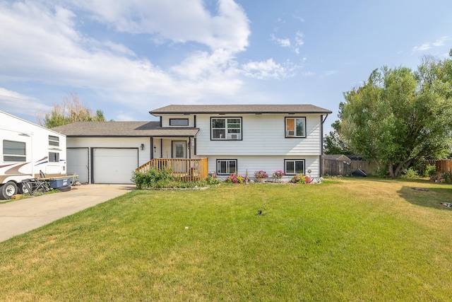 tri-level home with a front yard and a garage