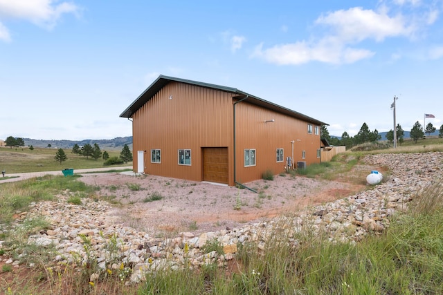 view of side of property featuring a garage