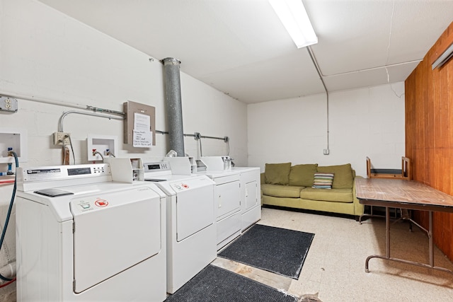 washroom with washing machine and clothes dryer