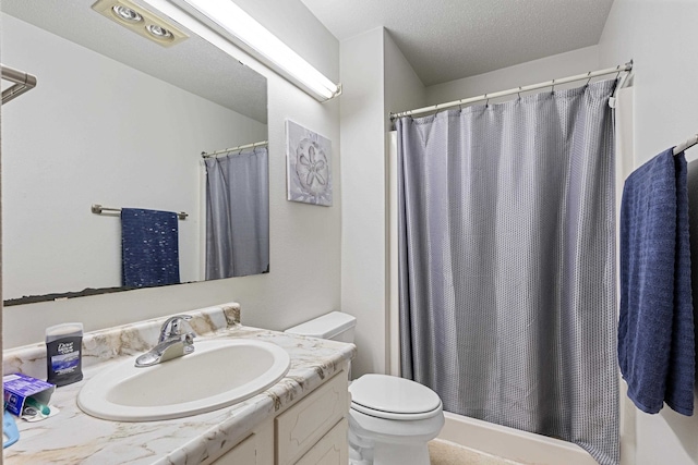 bathroom with vanity, a shower with shower curtain, a textured ceiling, and toilet