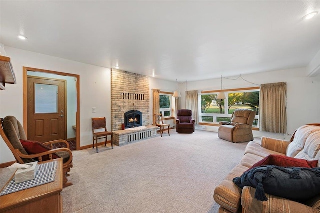 carpeted living area with a fireplace, recessed lighting, and baseboards