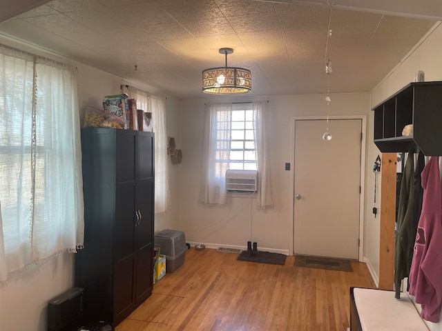 interior space featuring light hardwood / wood-style floors and cooling unit