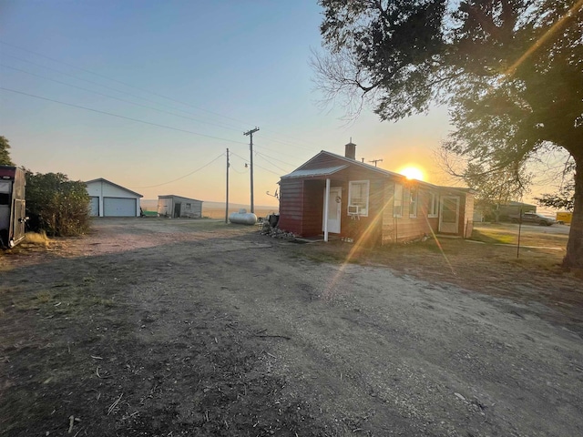 view of front of home featuring an outbuilding