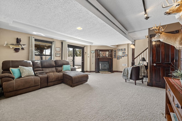 living room with carpet and a textured ceiling