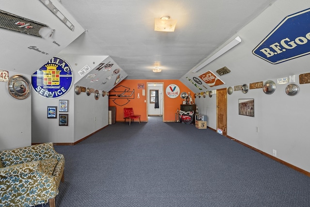 rec room featuring lofted ceiling and carpet floors