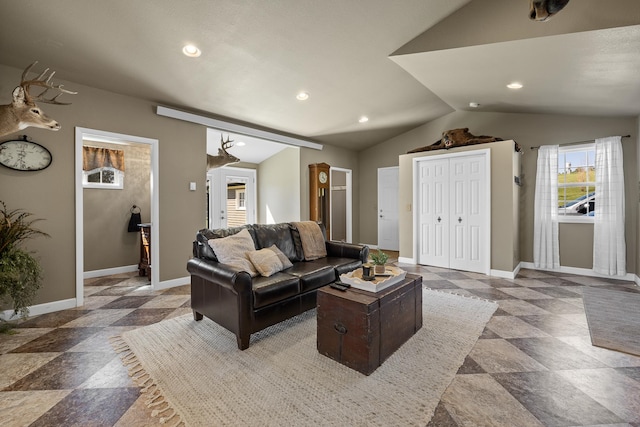 living room featuring vaulted ceiling