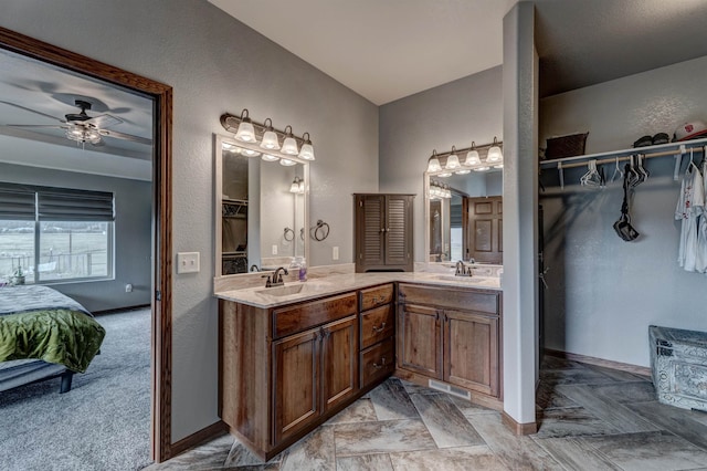 bathroom featuring ceiling fan and vanity