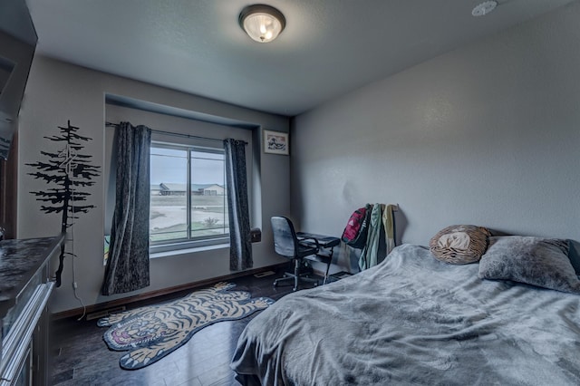 bedroom featuring dark hardwood / wood-style floors