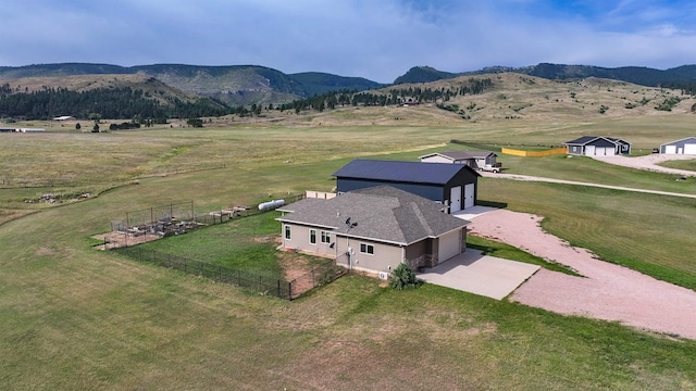 birds eye view of property with a mountain view and a rural view