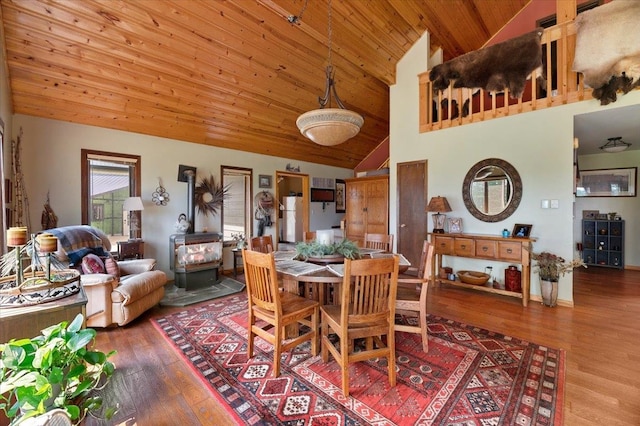 dining space with wooden ceiling, hardwood / wood-style flooring, and high vaulted ceiling