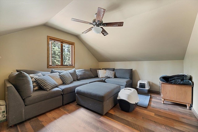 living room with dark wood-type flooring, lofted ceiling, and ceiling fan