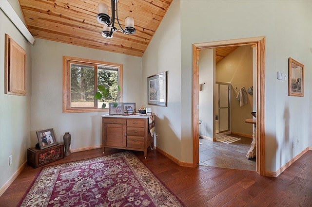 sitting room with wooden ceiling, dark hardwood / wood-style floors, vaulted ceiling, and a notable chandelier