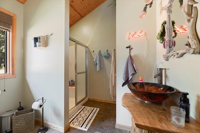 bathroom with vanity, walk in shower, wood ceiling, and vaulted ceiling