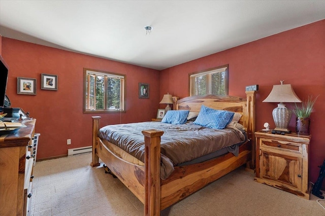 carpeted bedroom featuring a baseboard radiator