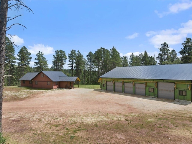 view of yard with an outbuilding and a garage